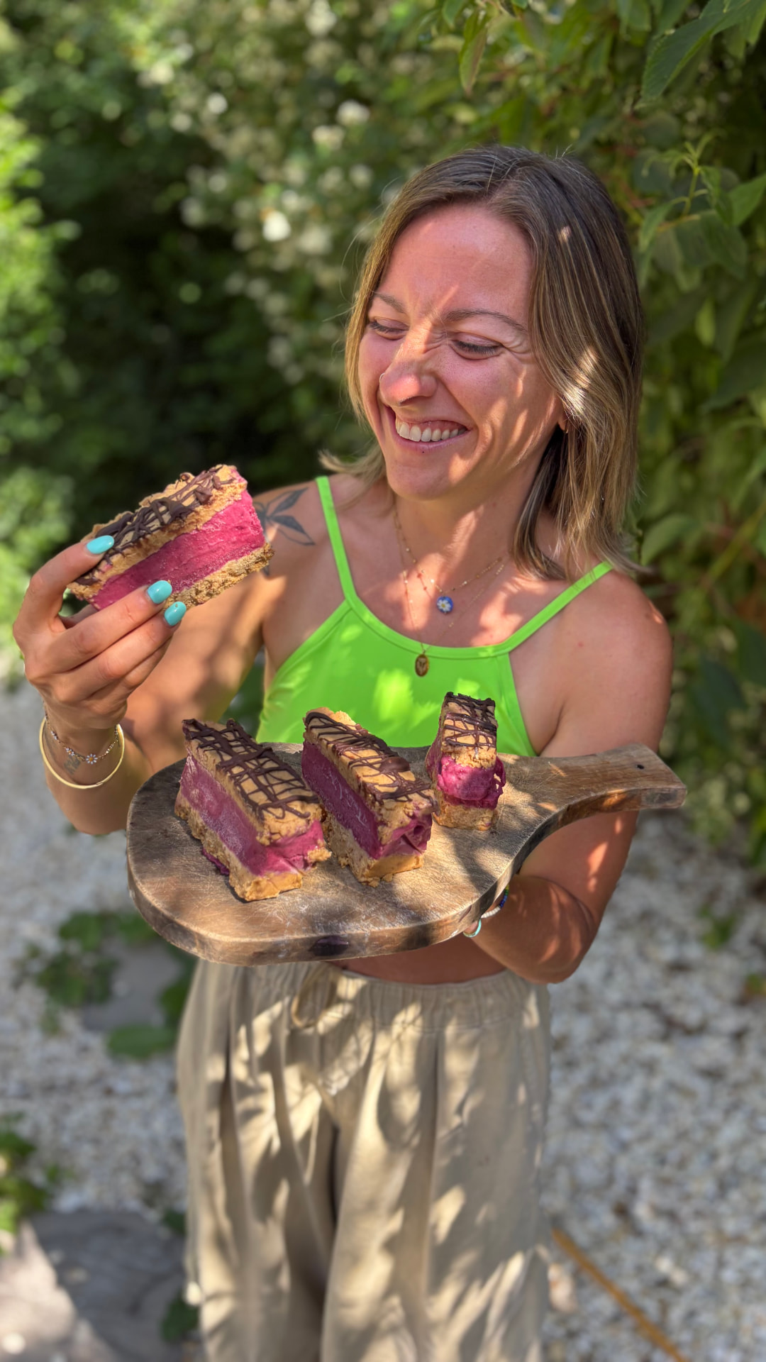 Ami eating a slice of plant-based dessert from a tray