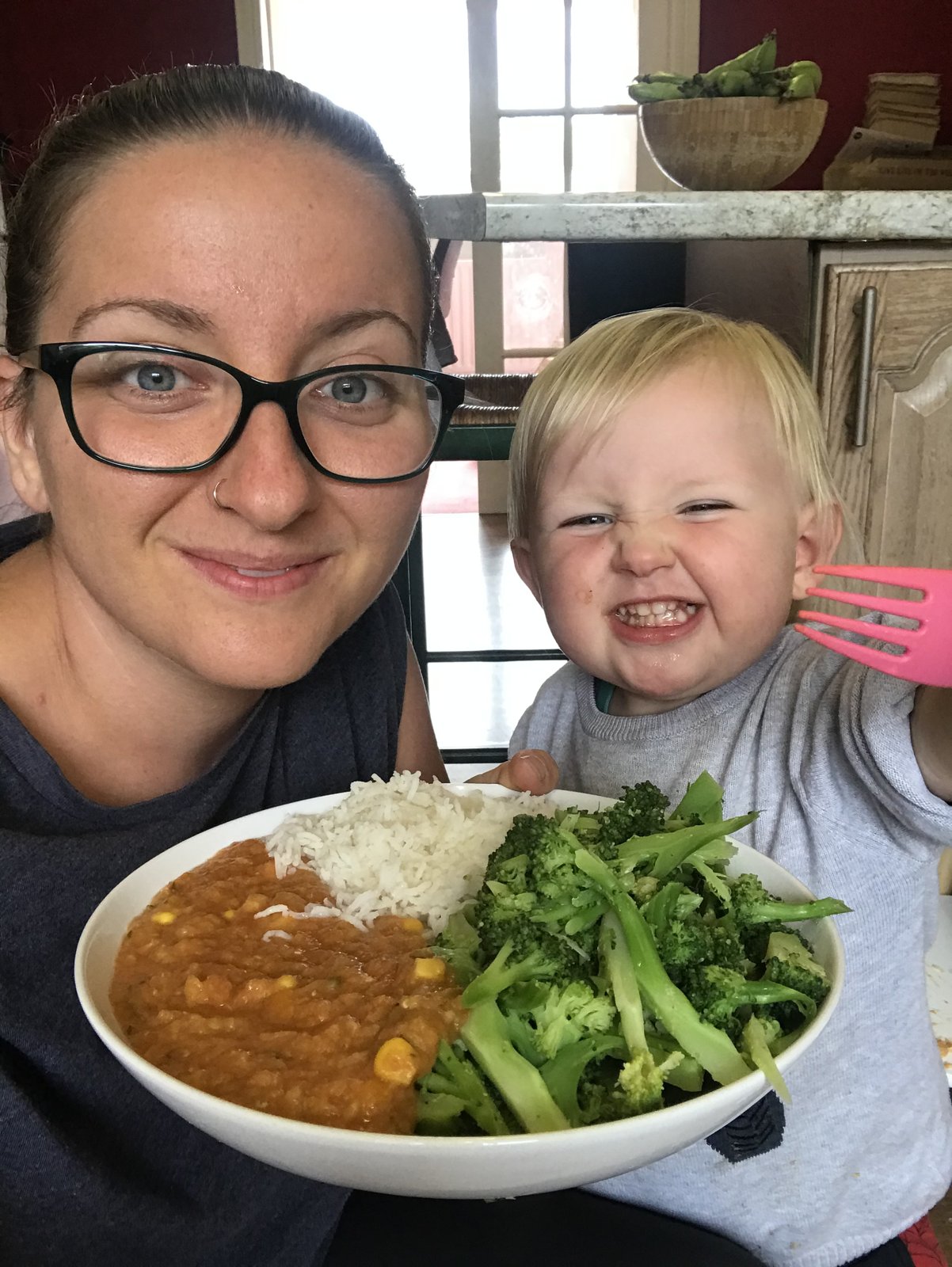 Ami and her son with a curry bowl she posted in July 2020