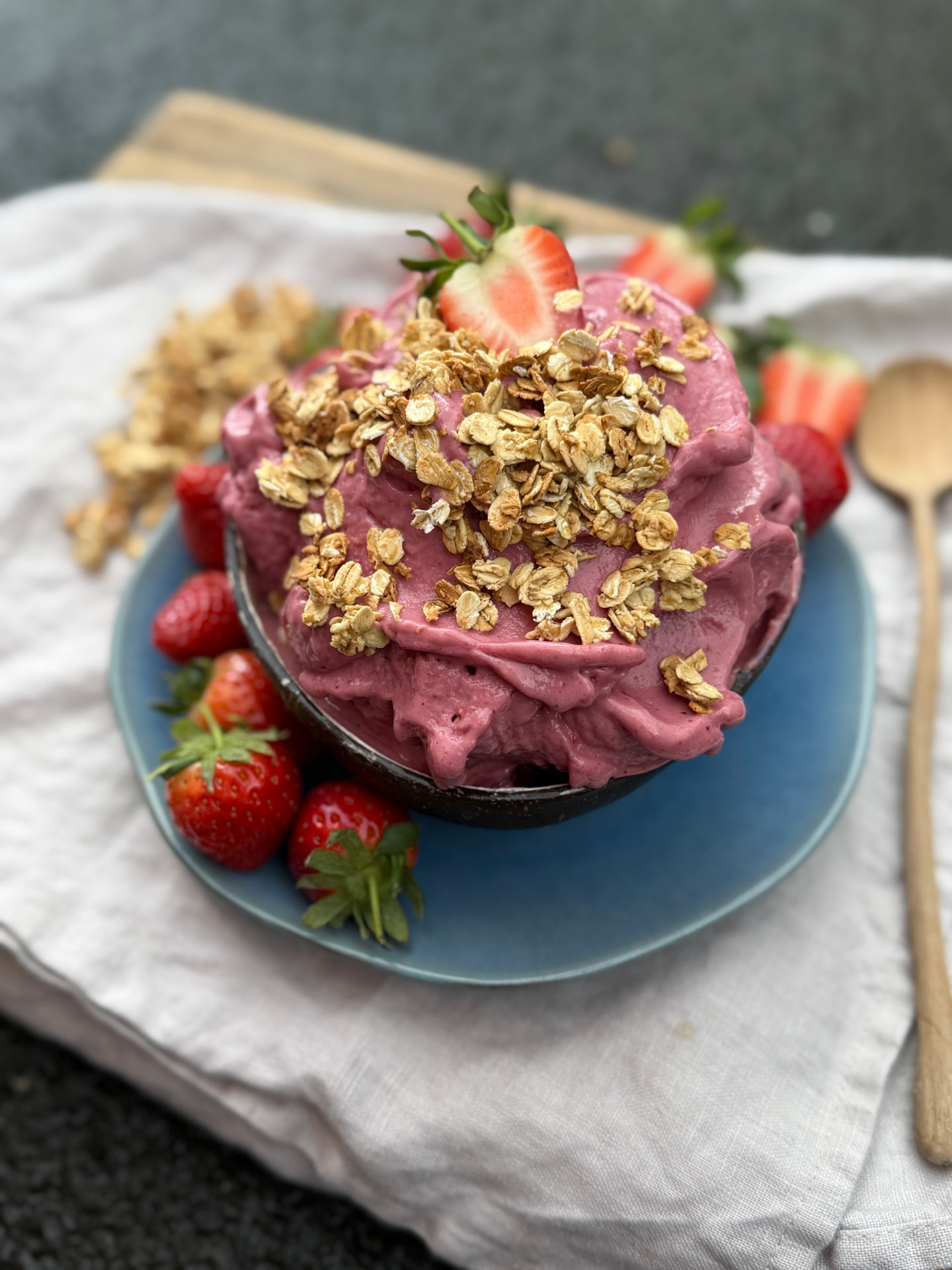 Berry nice cream bowl topped with granola