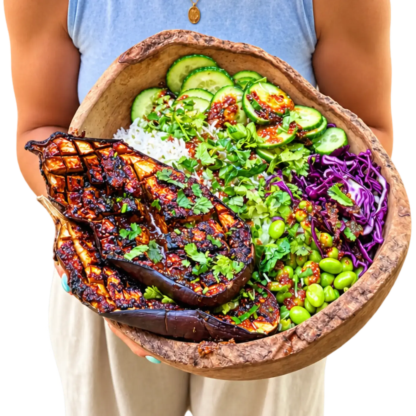 Ami holding a big wooden bowl of plant based food
